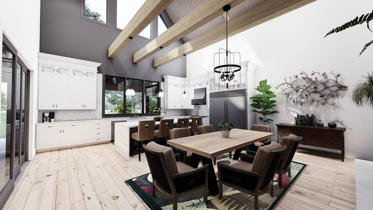 Open concept kitchen and dining area with vaulted beamed ceiling, island, modern cabinetry, and large windows.