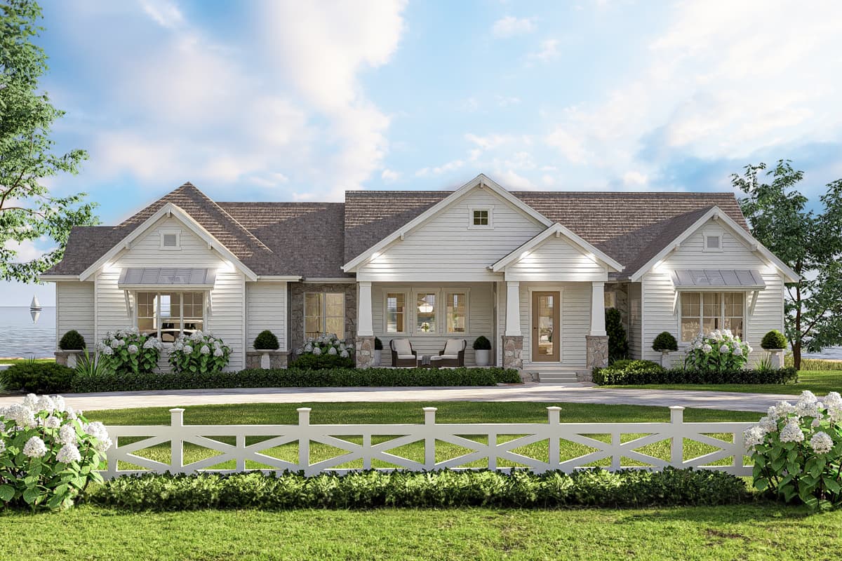 House plan exterior. A one-story house in farmhouse style features a front porch, gables, and a cross gable roofline.