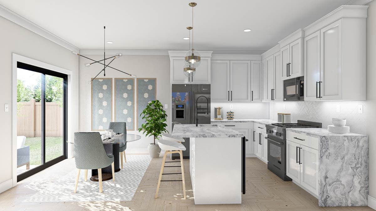 Modern kitchen with white cabinets, marble countertops, island with bar stools, dining area, and large sliding glass doors.