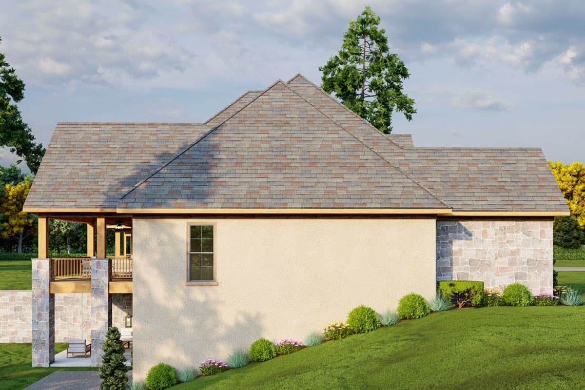 House plan exterior with multiple gables, covered porch, and stone and stucco finishes.