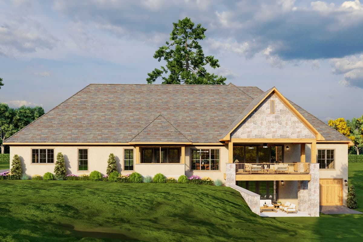 House plan exterior with a prominent gable, stone accents, covered upper balcony, and walk-out lower level.