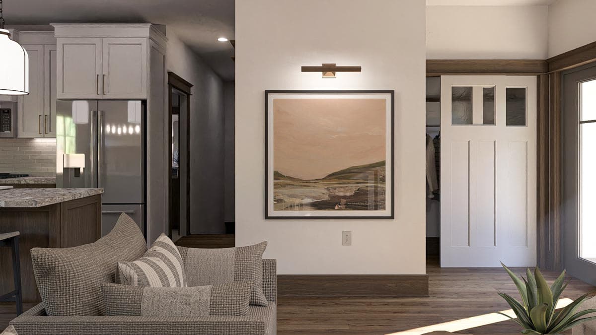 Interior view showing a living area with a sofa, kitchen cabinets, and a white paneled door with three glass panes.