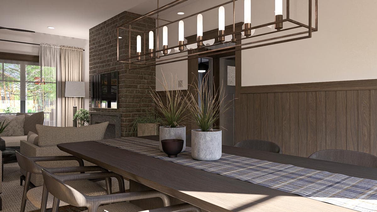 Open-plan living and dining area with stone fireplace, wood paneling, and modern chandelier.