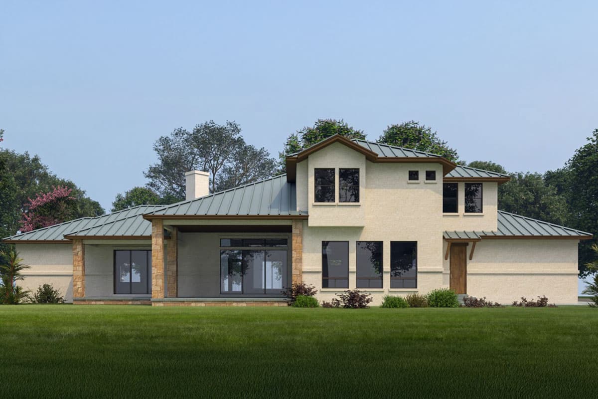 House plan exterior: two-story stucco home with metal roof, stone columns, covered patio, and multiple gables.