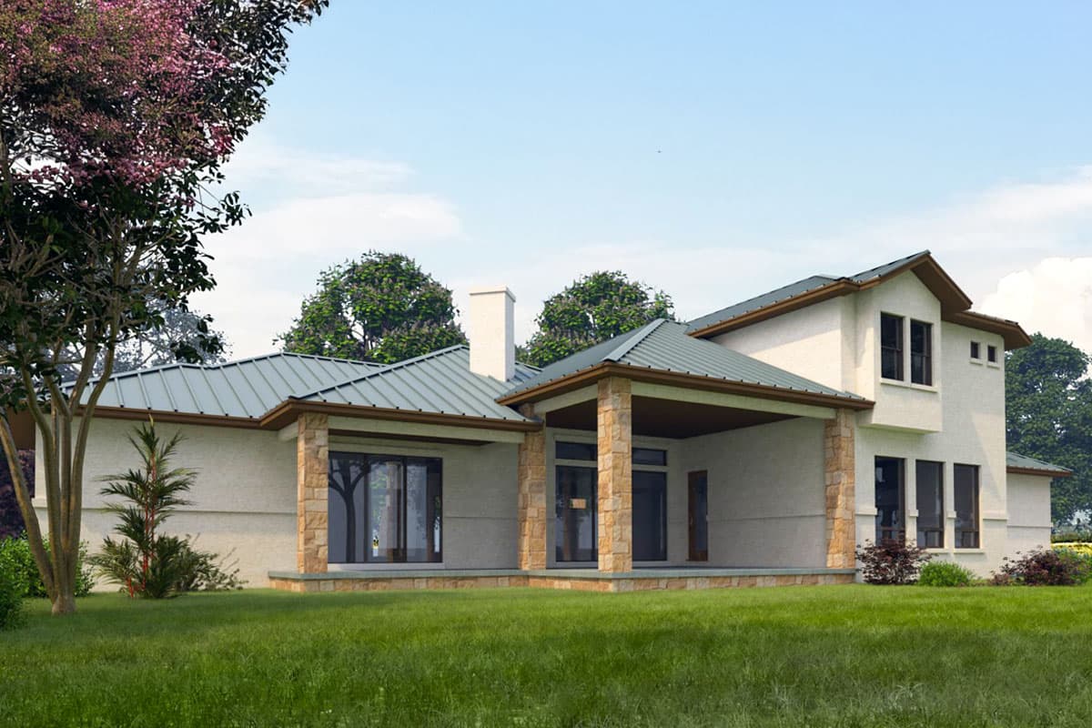 House plan exterior with a covered porch supported by stone columns, metal roof, and a two-story section.