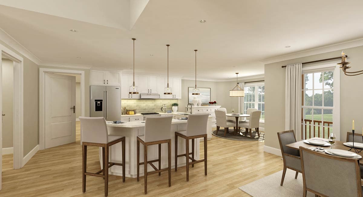 Open-concept kitchen with island seating, white cabinetry, stainless steel appliances, and adjacent dining area.