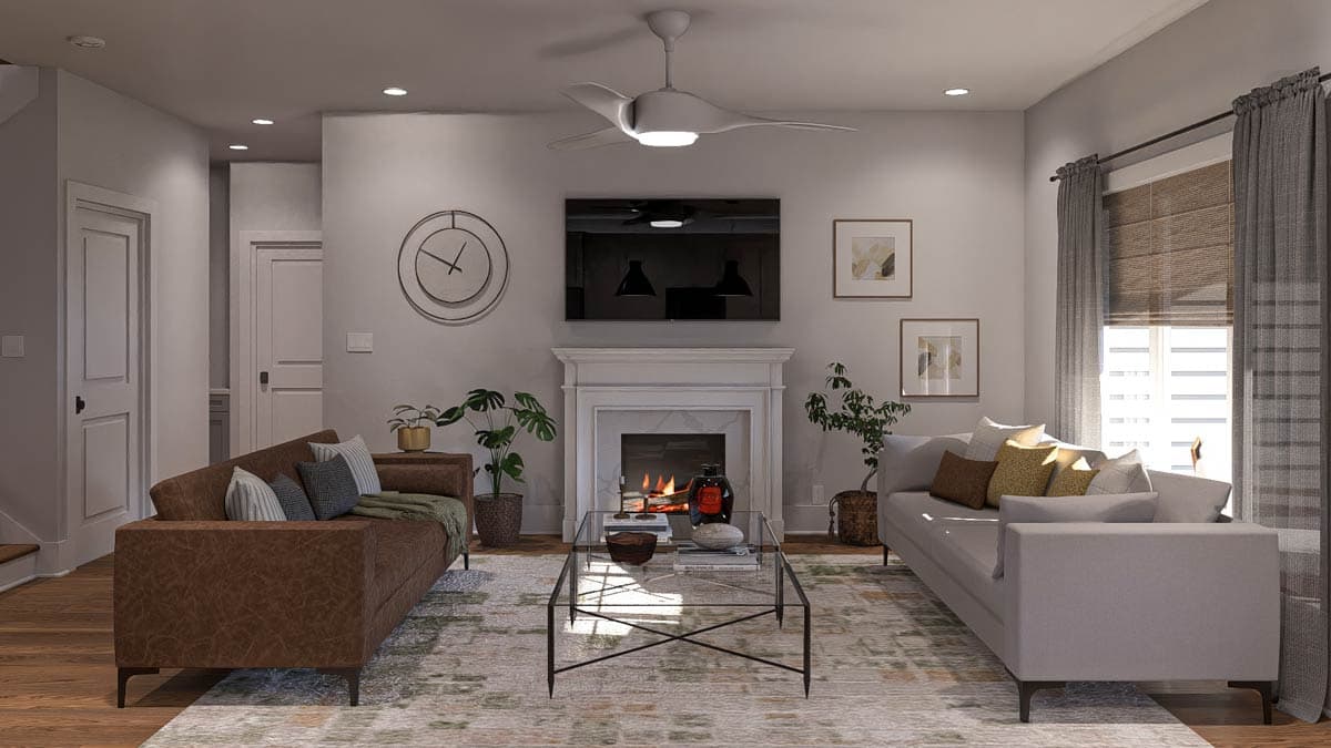 Living room with fireplace, television, two sofas, glass coffee table, and ceiling fan.