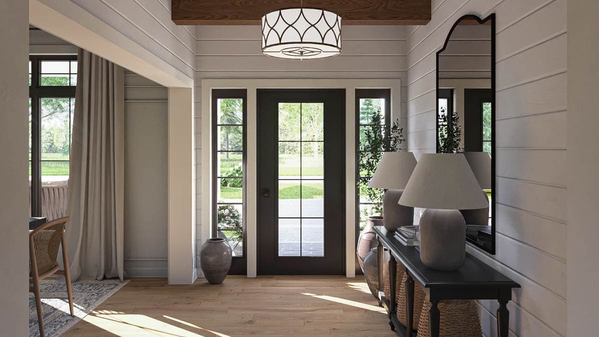 Interior rendering of a foyer with wood floors, paneled walls, a black door with side windows, and a chandelier.