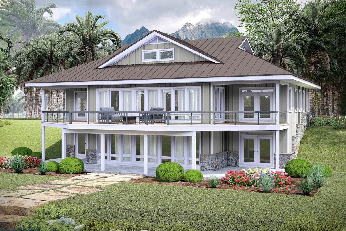 House plan exterior. Two-story home with a metal roof, two balconies, and stone accents. Features include gable roofline and multiple windows.