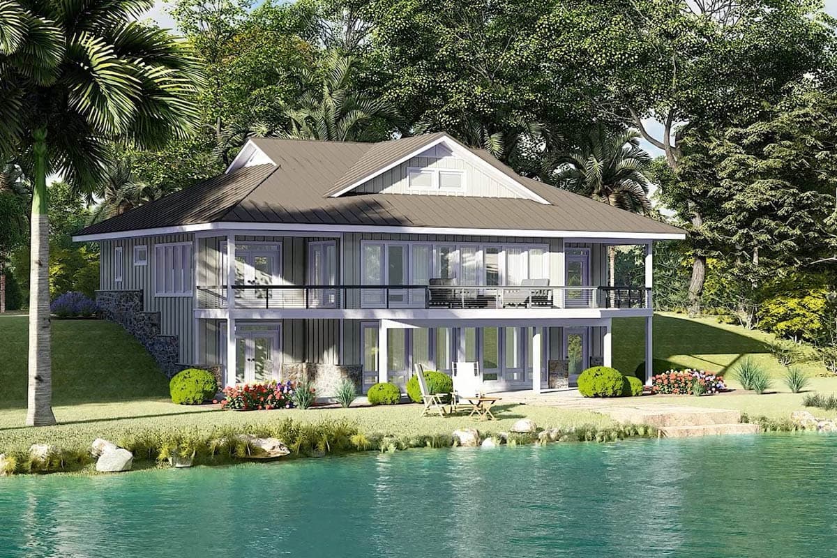 Modern house plan exterior with a metal roof, expansive upper deck, and stone accents on a sloped lot.