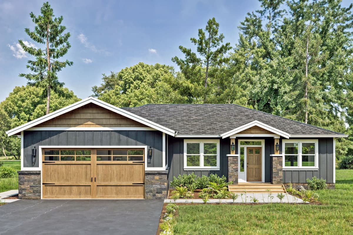 House plan exterior. Craftsman-style, one-story home with gabled roof, stone accents, and a front-facing garage with wood panel door.