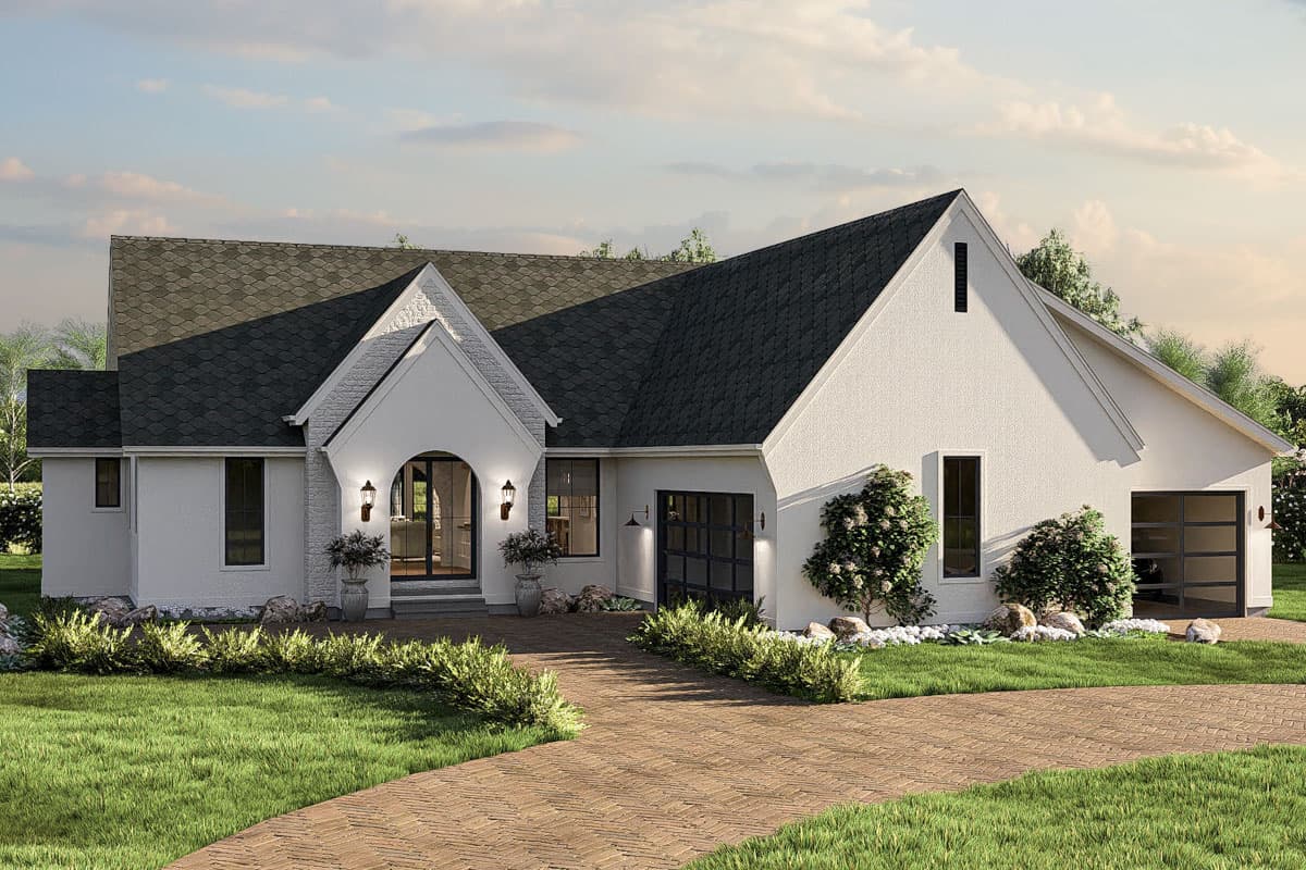 House plan exterior. One-story home with a gabled roof, arched entry, and two garage bays. Exterior features include brick pathway and landscaping.