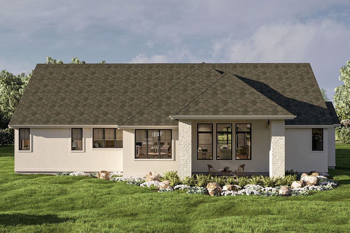 House plan exterior: Ranch style, single-story with large windows, a covered patio with seating, and a textured facade.