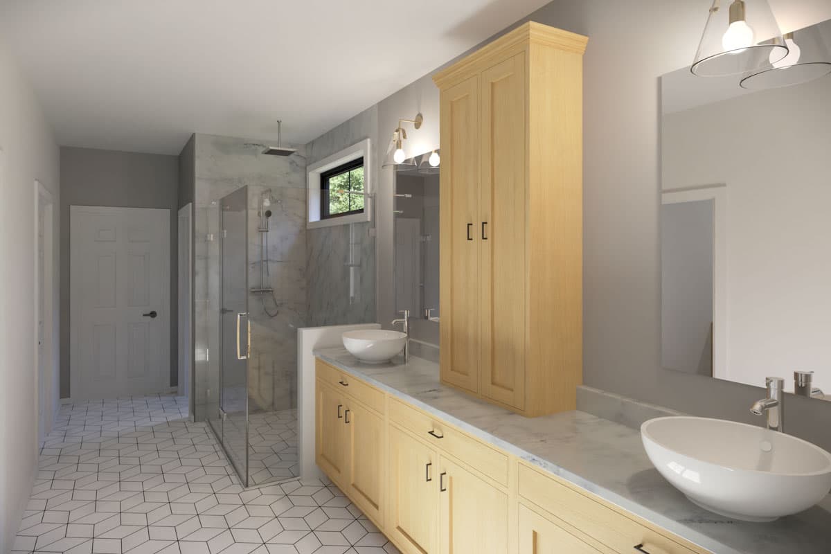Bathroom interior with wood cabinets, marble countertops, a walk-in shower, and a large mirror.