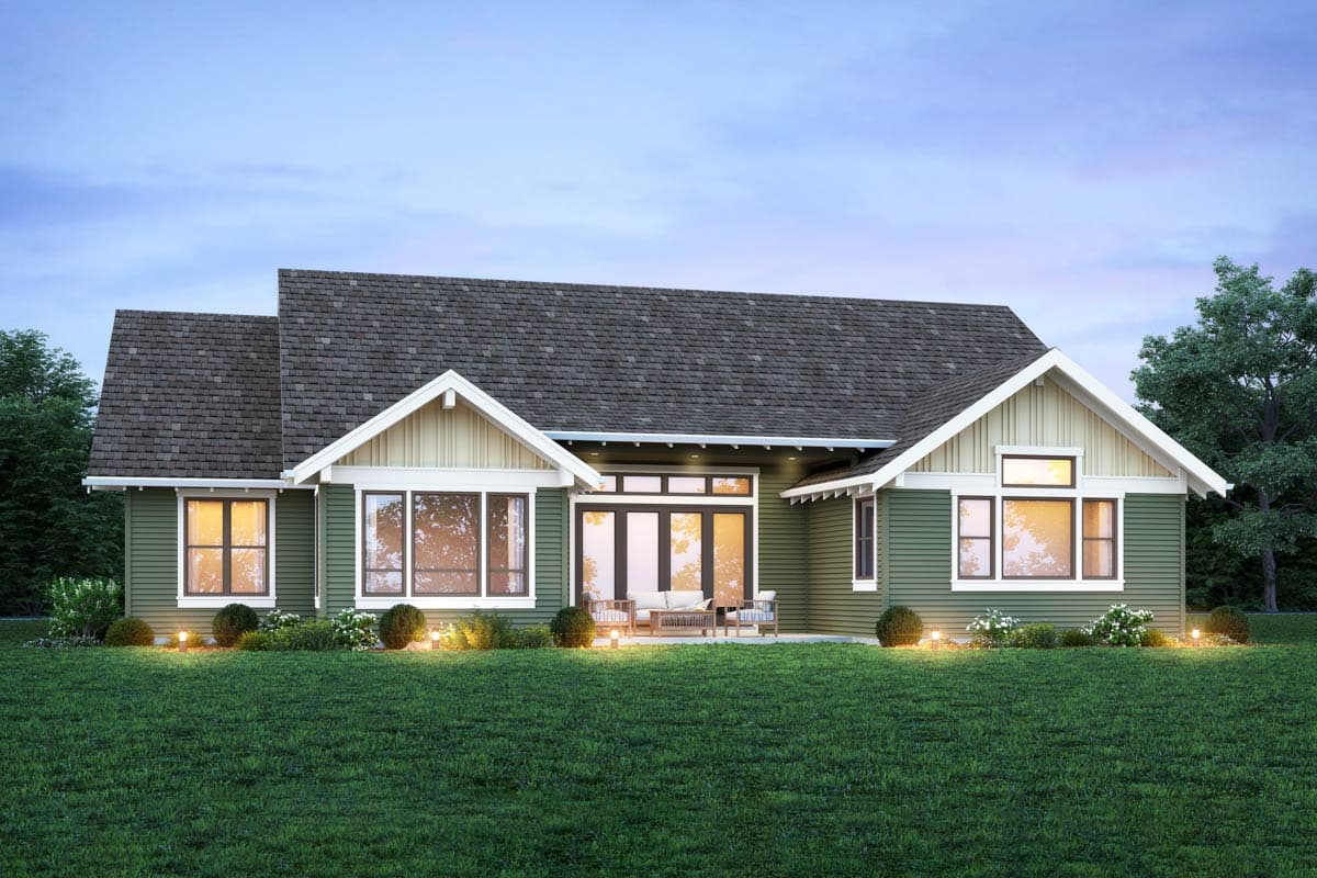 One-story house plan exterior with varied rooflines, prominent gables, and large windows.