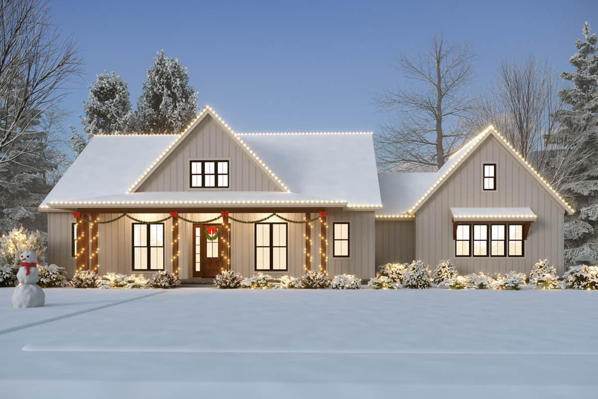 Modern Farmhouse house plan exterior with a covered porch, gable rooflines, and board and batten siding, decorated for winter holidays.
