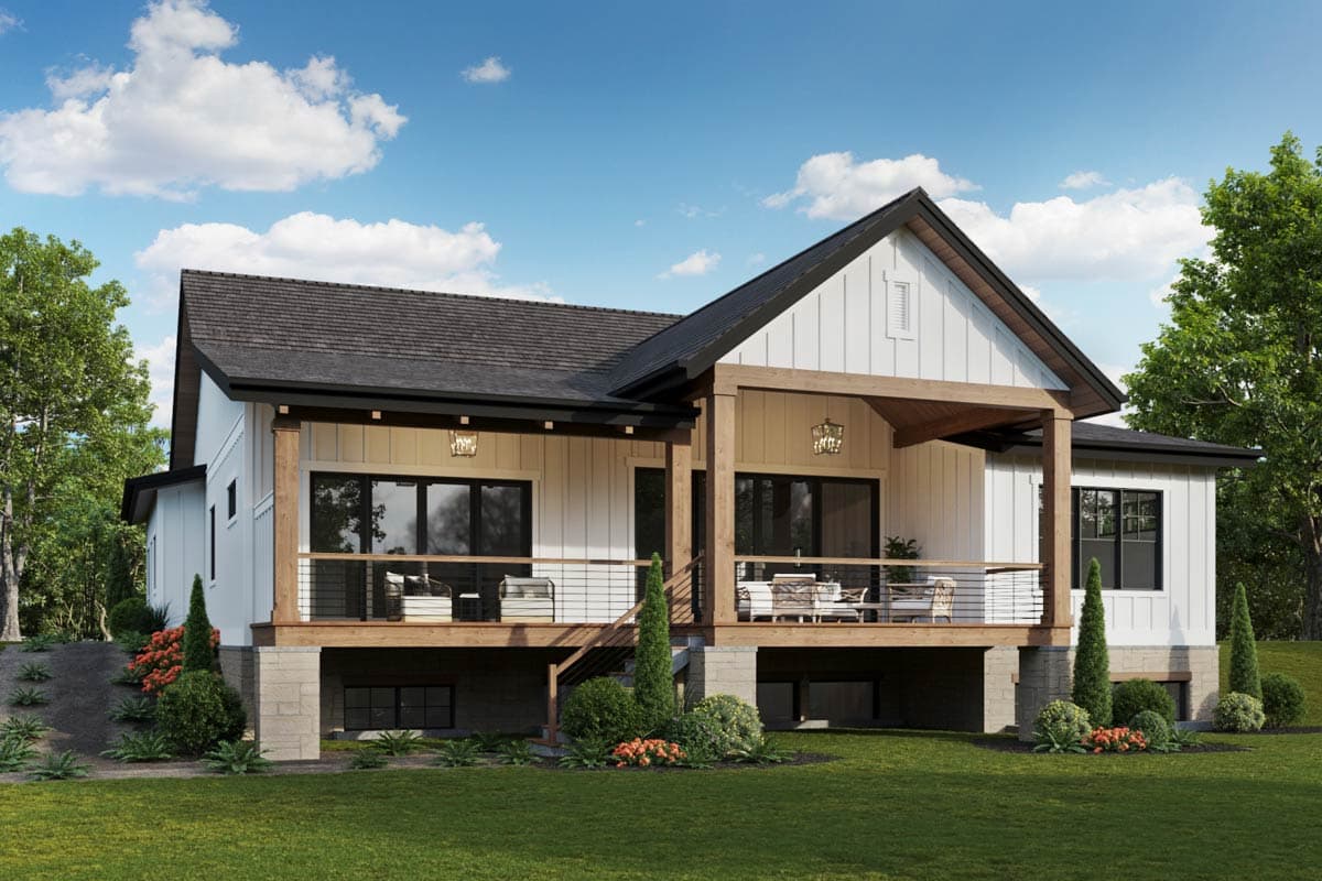 Modern Farmhouse house plan exterior with a covered deck, gables, and large windows.