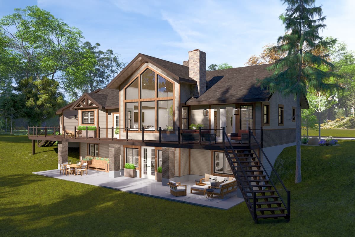House plan exterior: two-story home with gabled roof, large central windows, wraparound deck, and stone chimney.