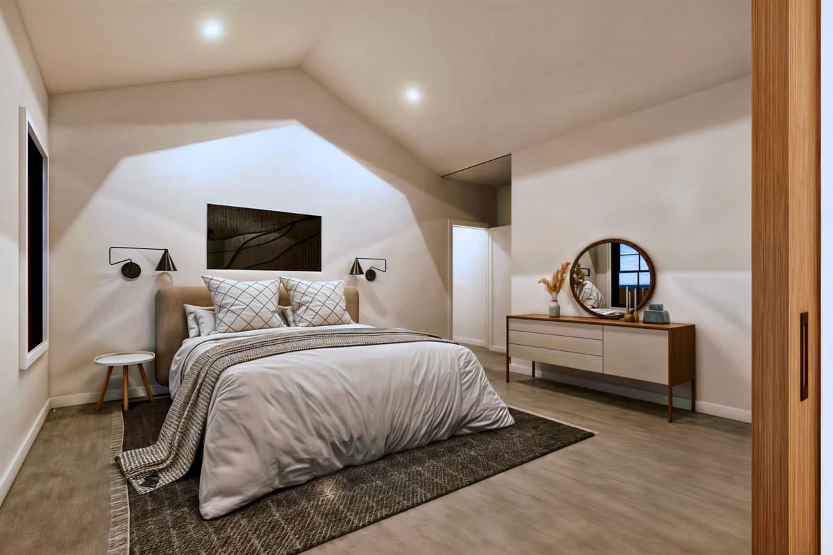 Modern bedroom with a bed, dresser, and round mirror. The room has neutral tones, a high ceiling, and sconces flanking a piece of art.