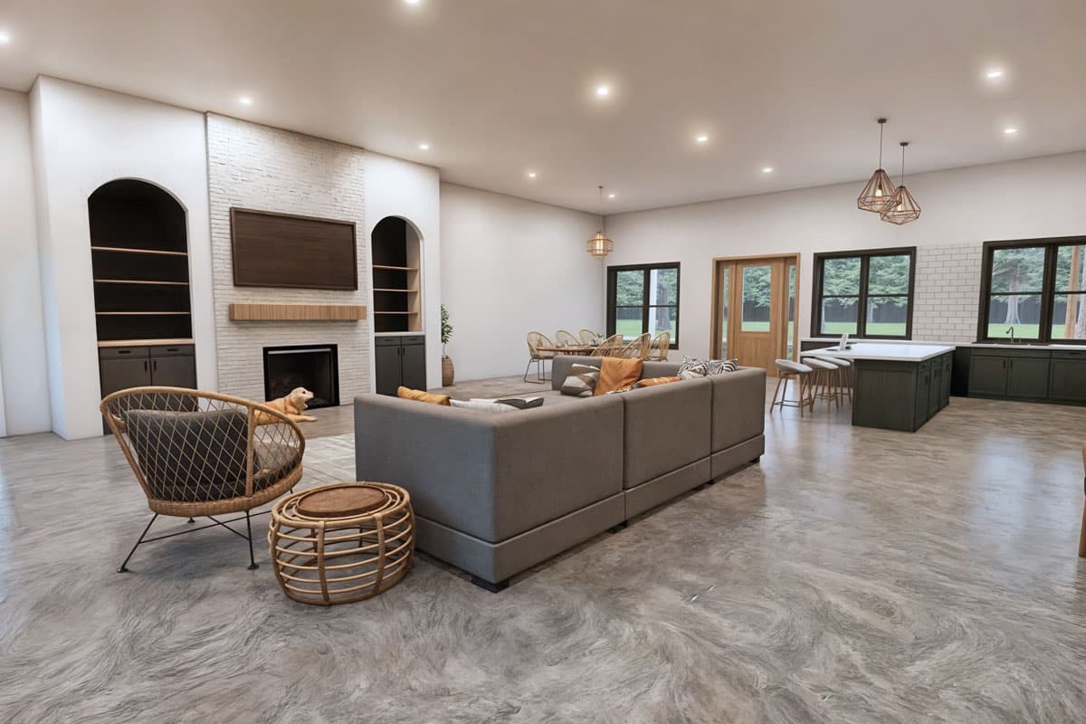 Spacious, open-concept living room and kitchen design. Includes a large sectional sofa, fireplace, and kitchen island with bar stools.