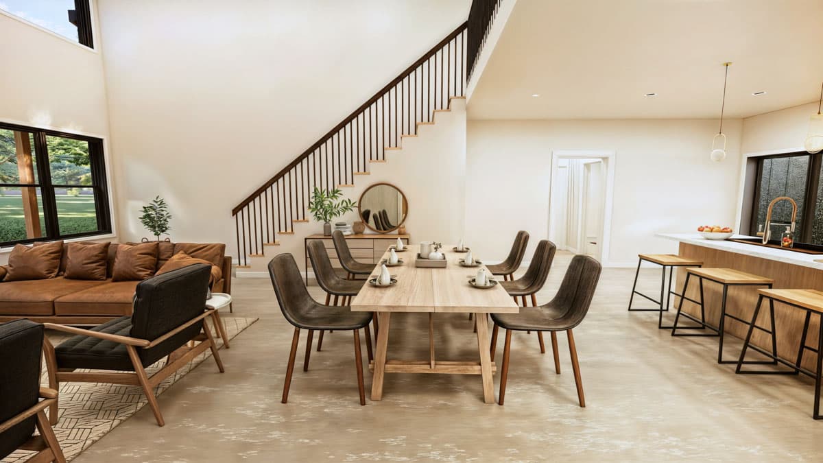 Modern open-concept living area with vaulted ceiling, staircase, dining table, and kitchen island.