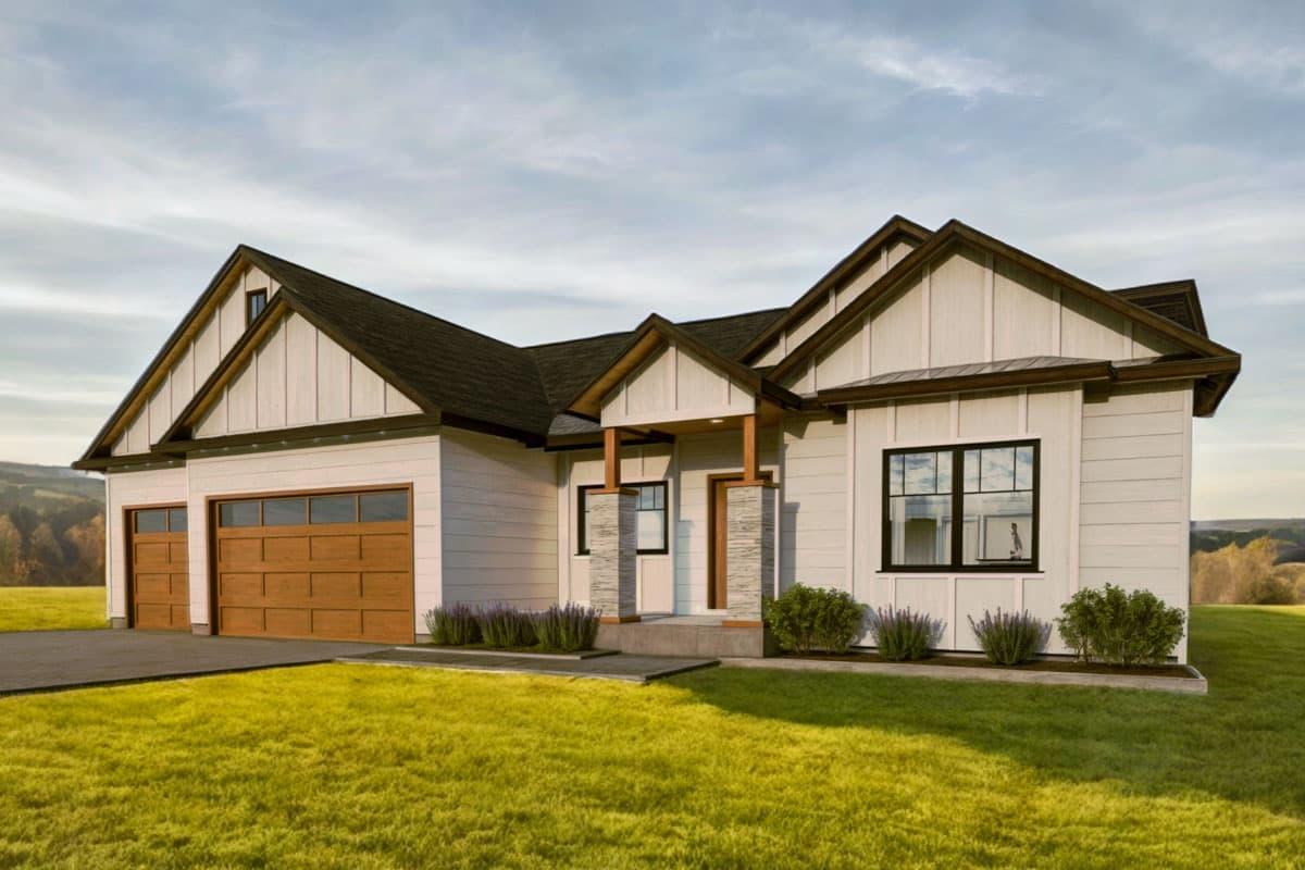 A modern, white farmhouse with brown trim and accents sits on a grassy lawn. Large windows and a wooden garage door add detail.
