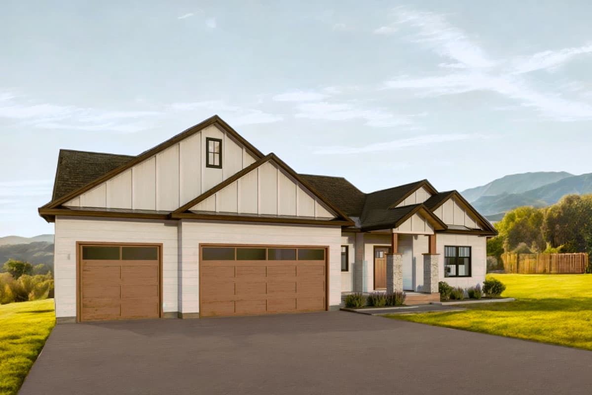 A modern, two-car garage home with white siding, wood-toned garage doors and a brown roof, set against a backdrop of green hills.