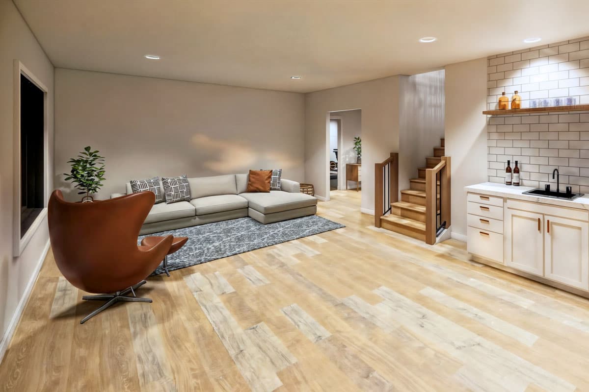 Modern living room featuring an egg-shaped leather chair, a sectional sofa, and a small bar area with a staircase leading up.
