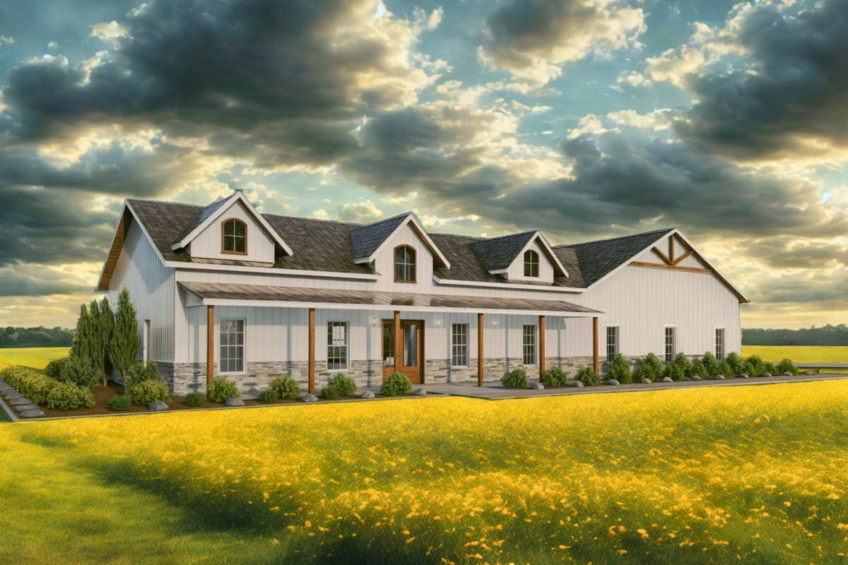 A white farmhouse with a large porch and dormers sits amidst a field of yellow wildflowers under a dramatic, cloudy sky.