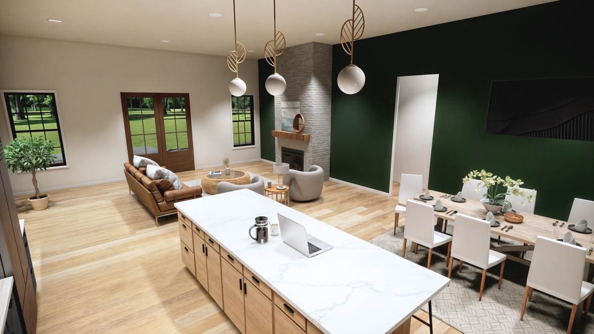 Spacious, modern living space with a large island, dining area, and living room setup. Features include a fireplace, and hardwood floors.