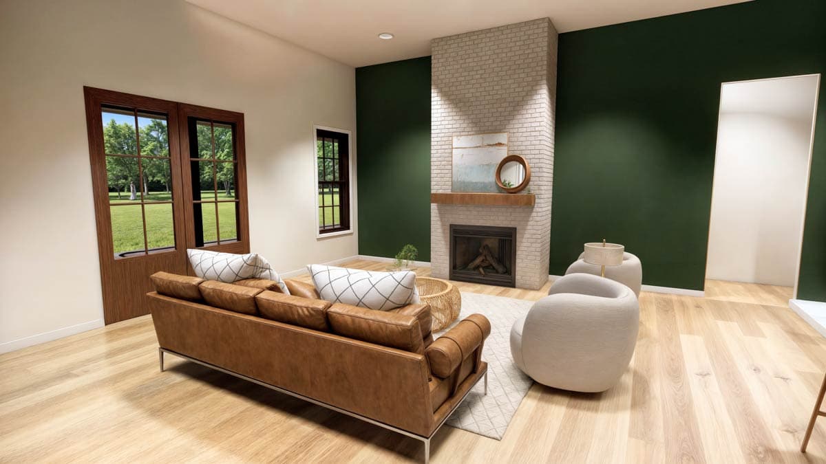 A modern living room with a leather sofa, brick fireplace, and large windows looking out onto a green lawn.
