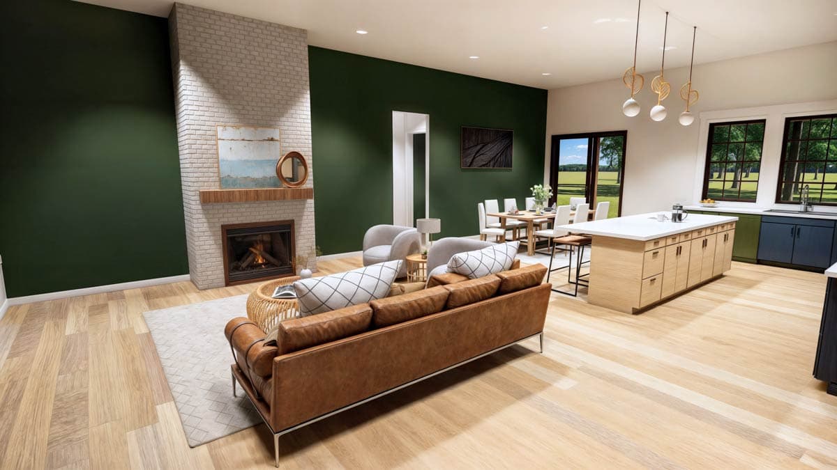 Spacious, modern living room with a brick fireplace, leather couch, and open kitchen with a large island and dining area.