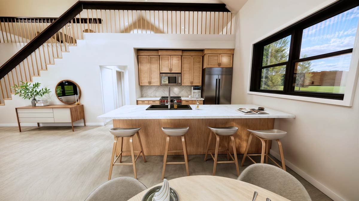 Interior view of modern kitchen with island, wood cabinets, stainless steel appliances, and open staircase to loft.