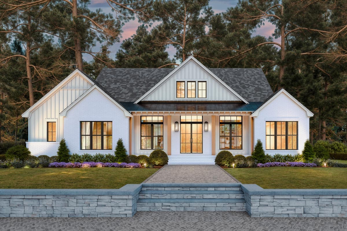 House plan exterior. Modern Farmhouse style with brick facade, front gables, and a covered porch. Features include large windows and a dark roof.