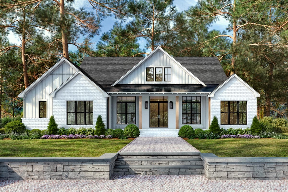 Modern Farmhouse house plan exterior with white brick, multiple gables, metal roof accents, and a covered entry.