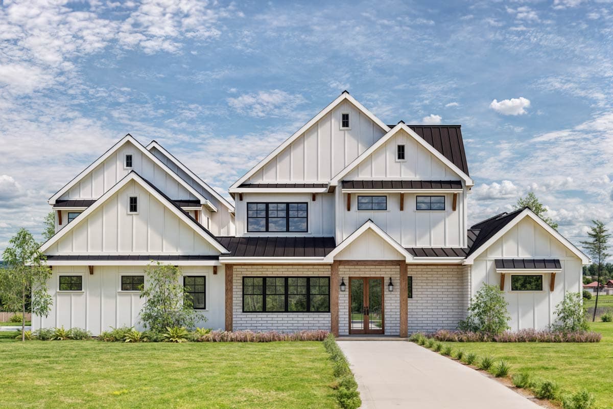 House plan exterior. Two-story Modern Farmhouse with board and batten siding, multiple gables, and a mix of windows.