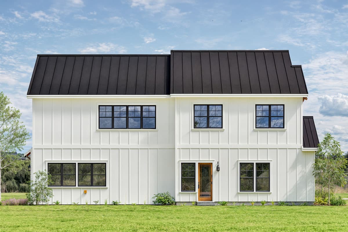 Two-story Modern Farmhouse exterior plan with vertical siding, black metal roof, and grid windows.