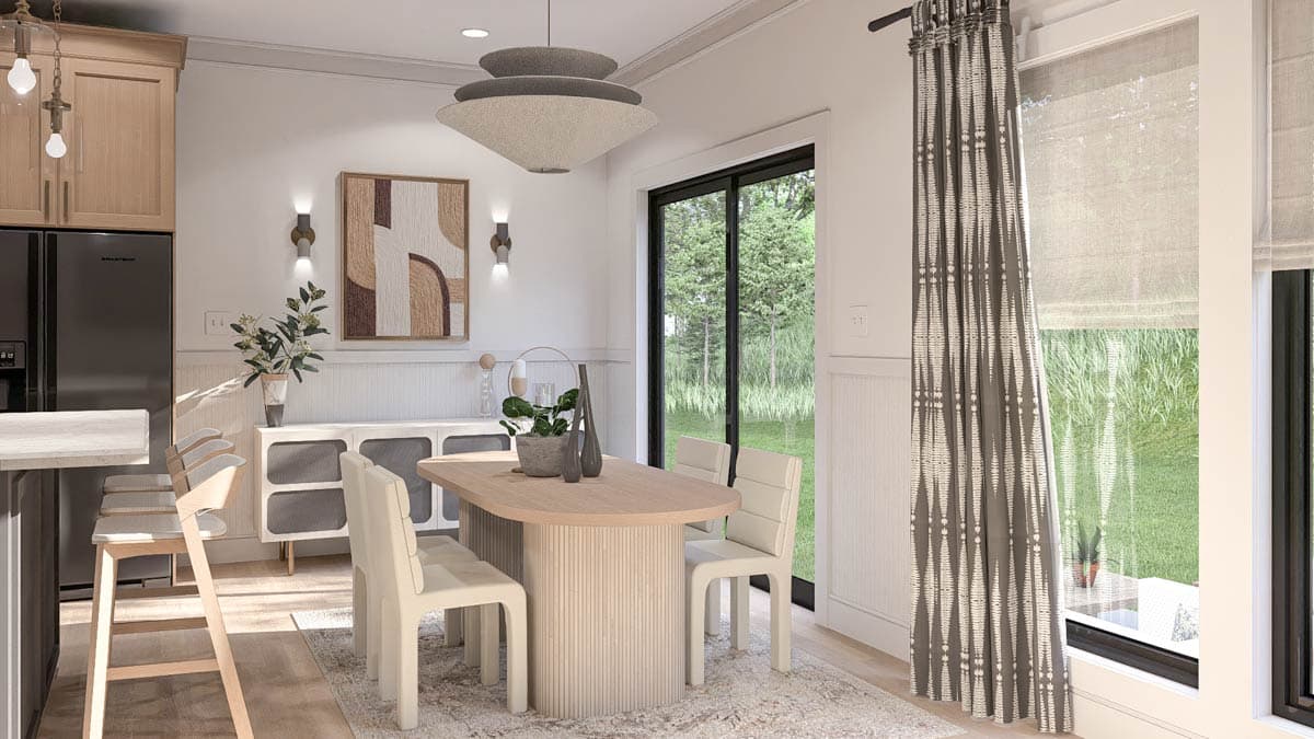 Dining area with oval wood table, chairs, pendant light, sideboard, and sliding glass door.