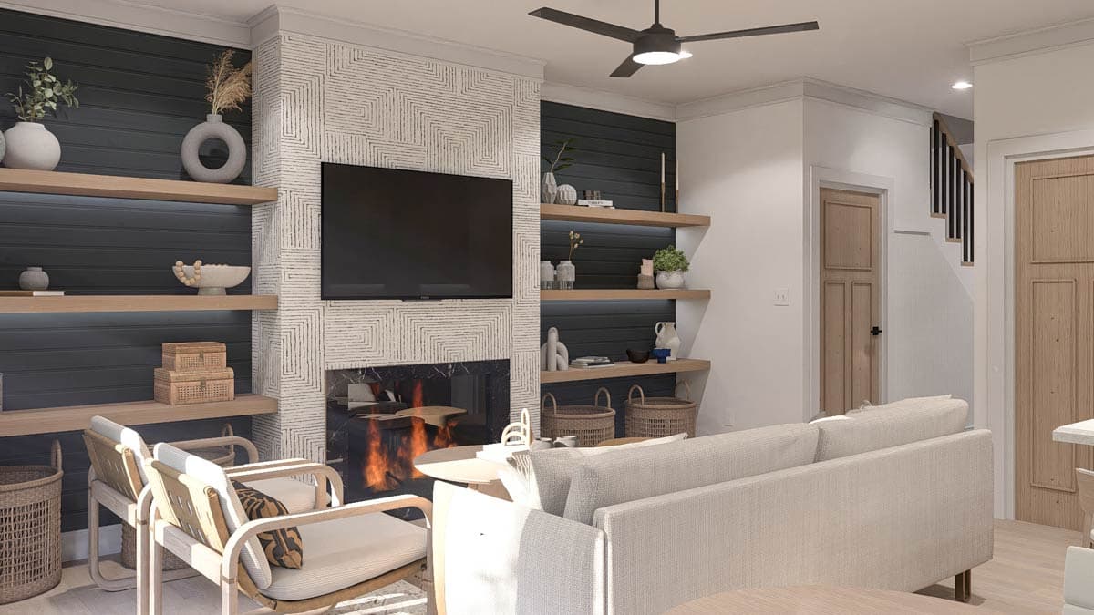 Living room with fireplace, television, built-in shelving, and staircase. Modern design.
