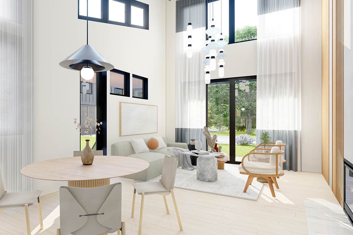 Open-concept living and dining area with soaring ceilings, large windows, modern furniture, and a light wood floor.