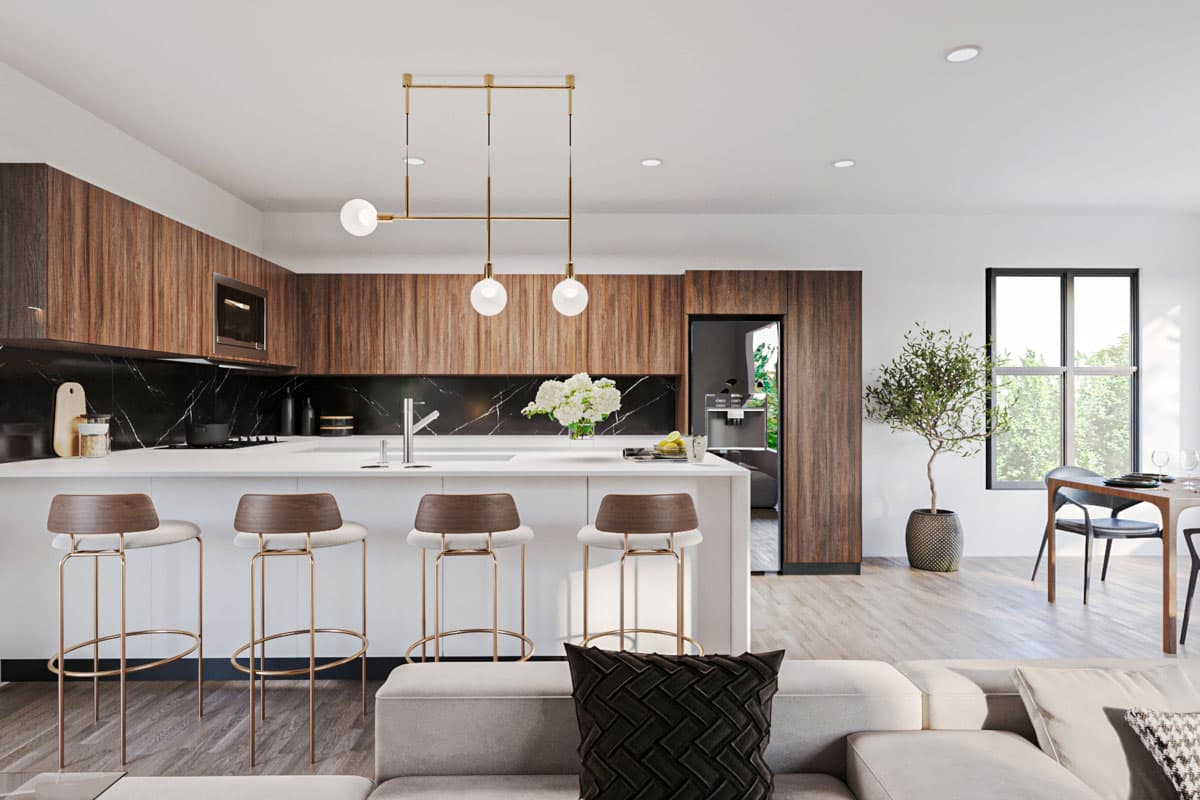 Modern kitchen with island, wood cabinetry, black marble backsplash, and minimalist pendant lighting.