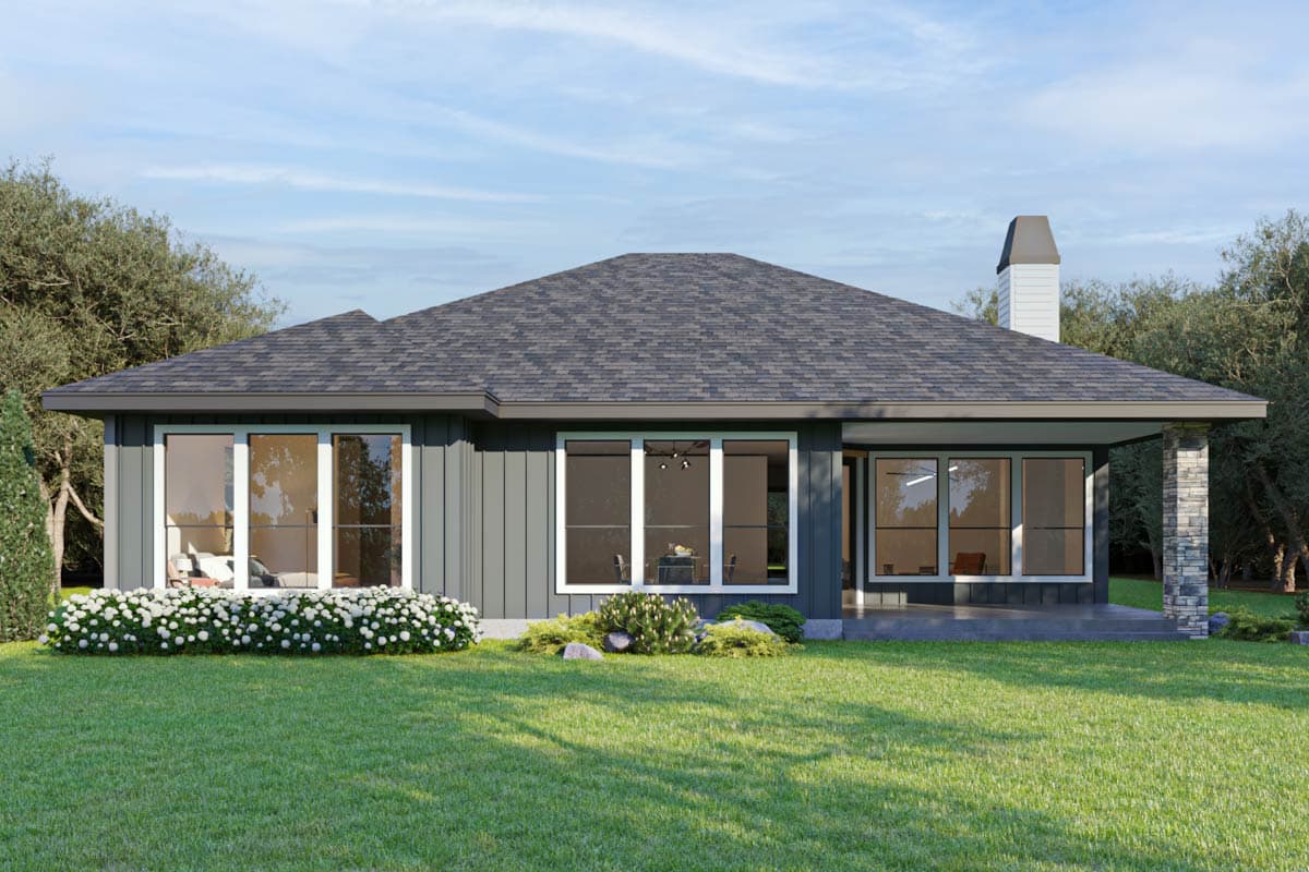 House plan exterior view: Ranch style, one story, featuring a prominent roofline, large windows, covered patio, and stone-accented support column.