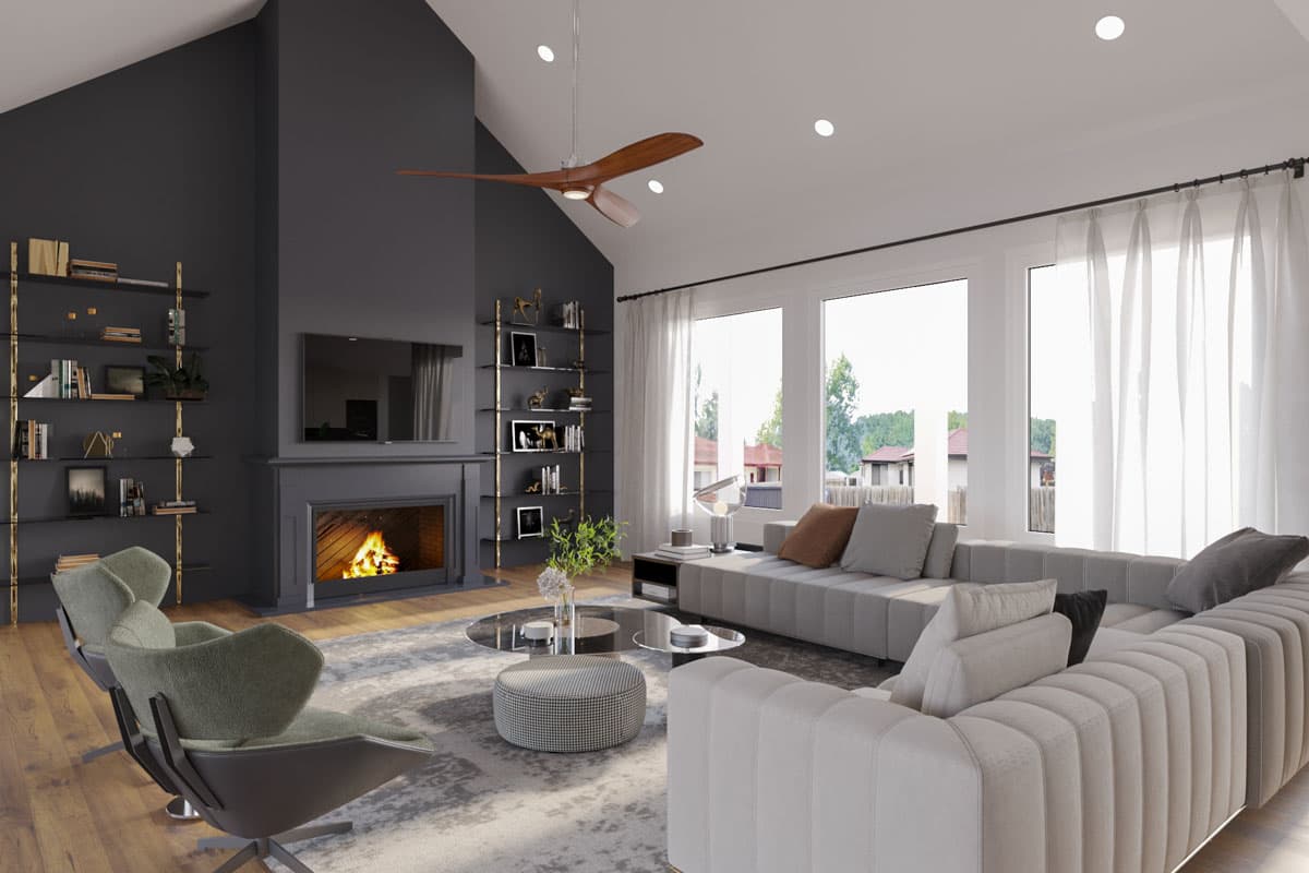 Great room with vaulted ceiling, fireplace, extensive windows, and modular sectional sofa.
