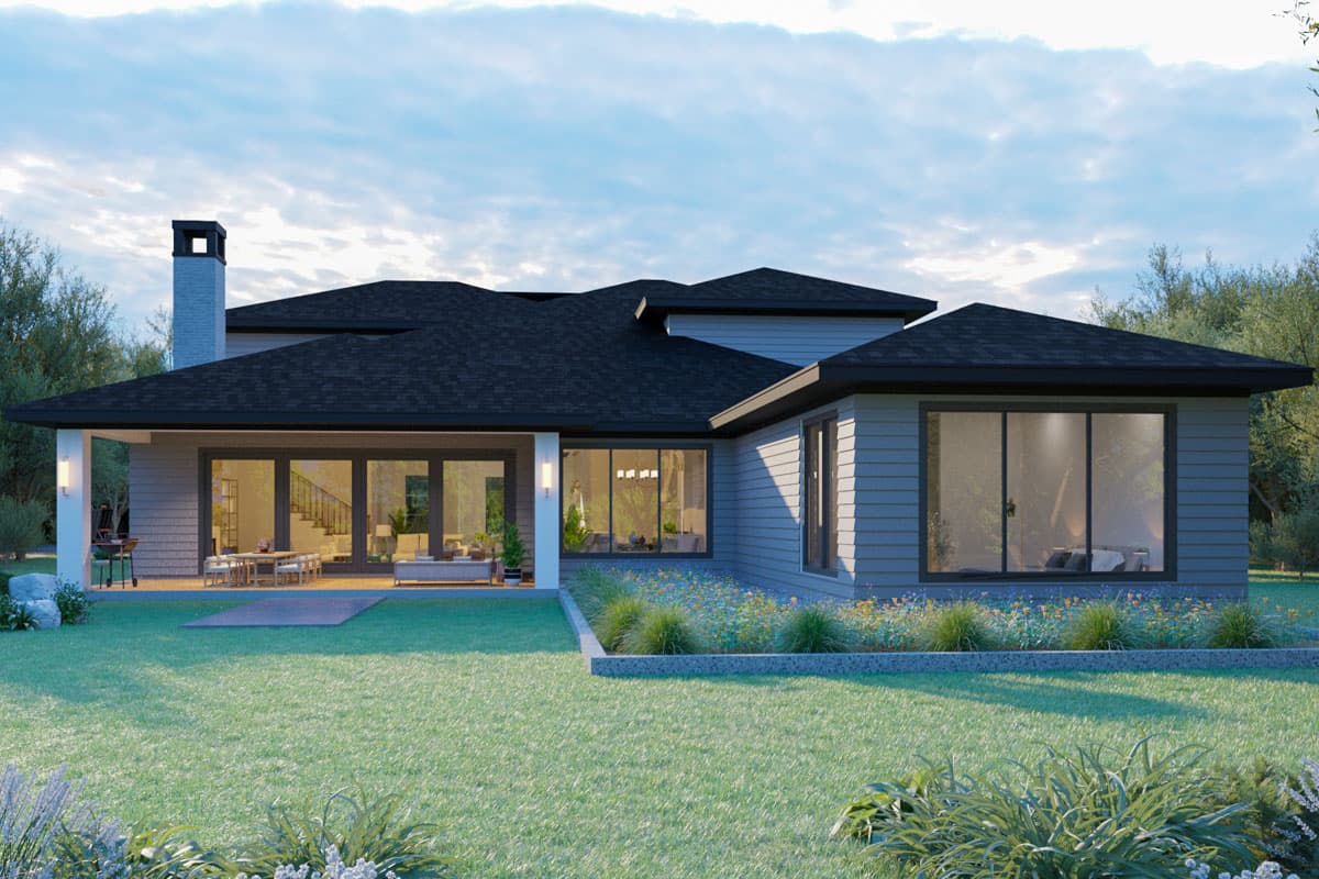 Modern house plan exterior with covered patio, prominent chimney, and large windows.