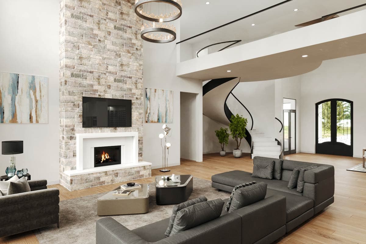 Great room with stone fireplace, vaulted ceiling, floating staircase, and black double doors.
