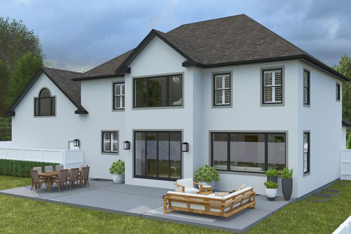 House plan exterior: two-story white stucco home with gables, large windows, and a patio with outdoor furniture.