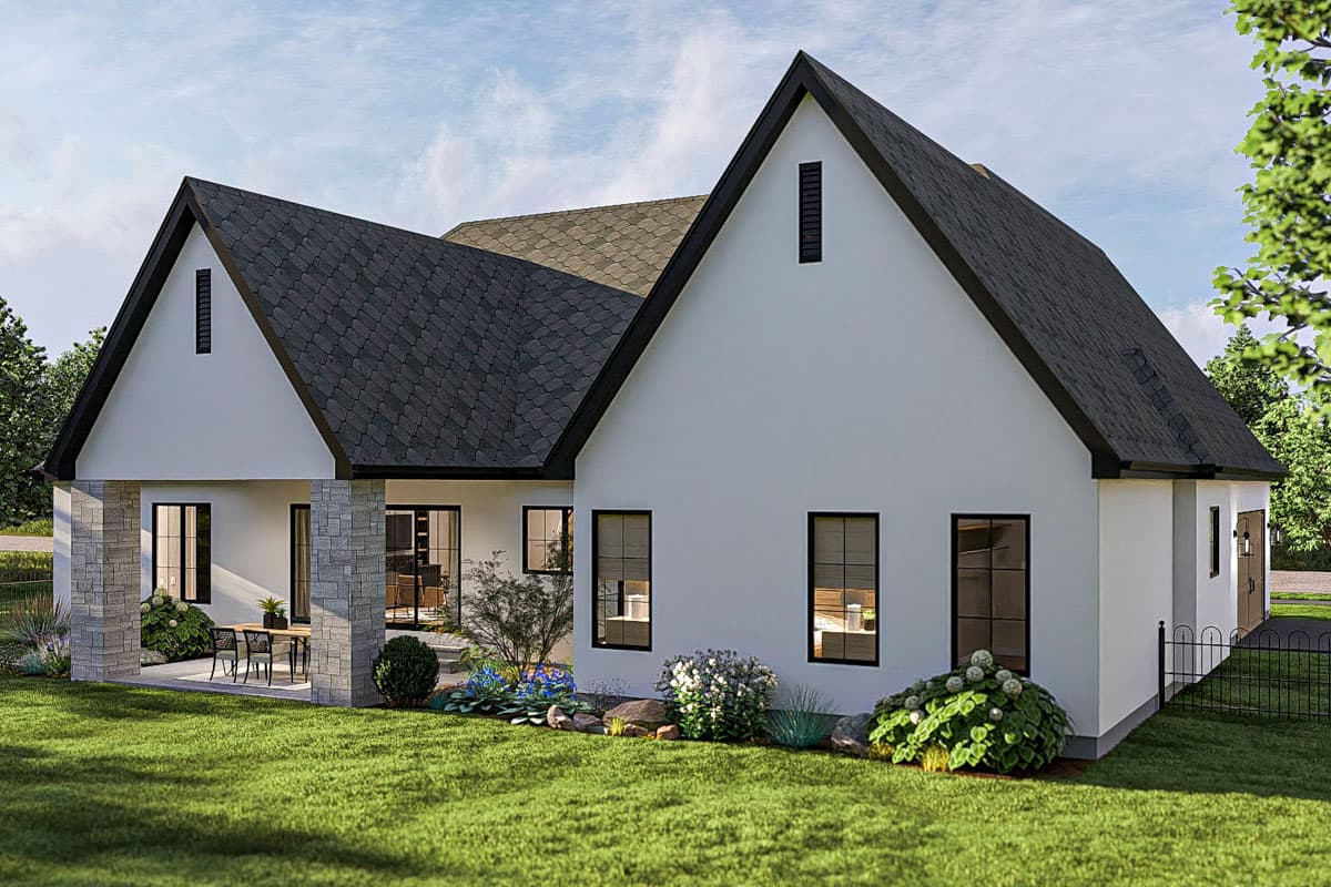 Modern farmhouse house plan exterior with gables, a covered porch with stone columns, and a garage.