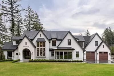 6-Bed Transitional French Country House Plan with 2-Bed Apartment - 4954 Sq Ft
