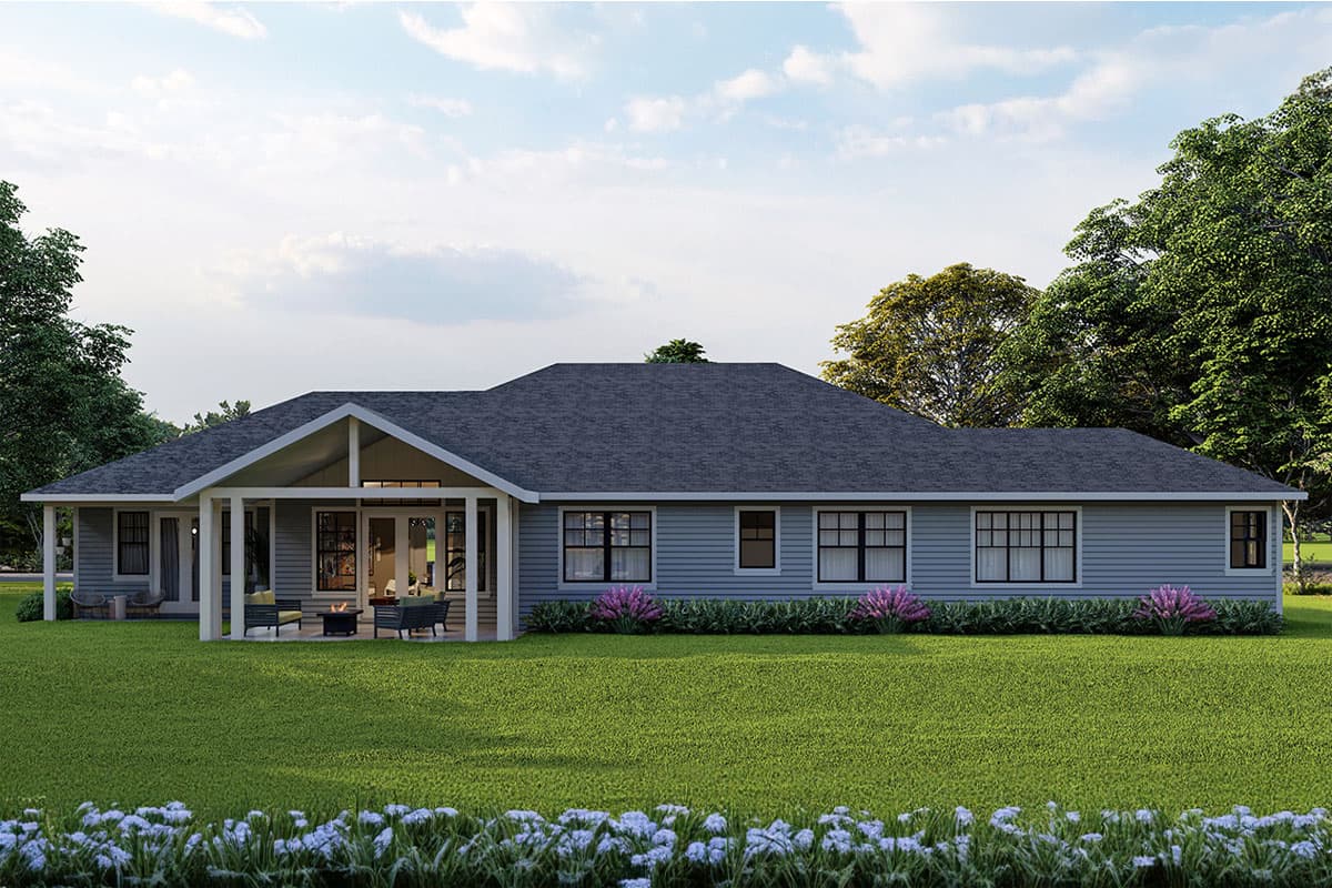 House plan exterior: single-story ranch with gabled roof, covered patio with fireplace, and large windows.