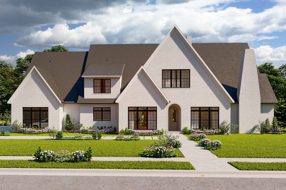 House plan exterior. Two-story home with a gable roof, dormers, and a prominent chimney. Features include a front entry with an arched doorway.